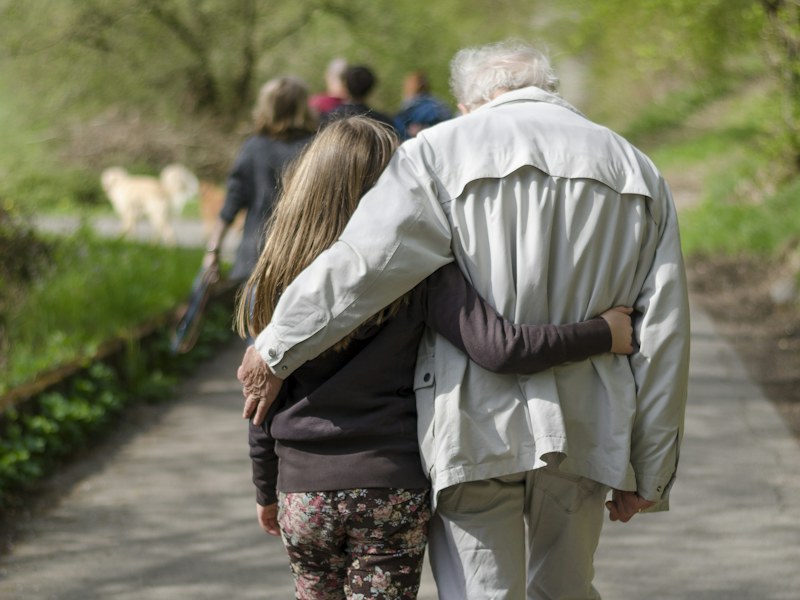 Adult and child walking together representing calcium needs at every age