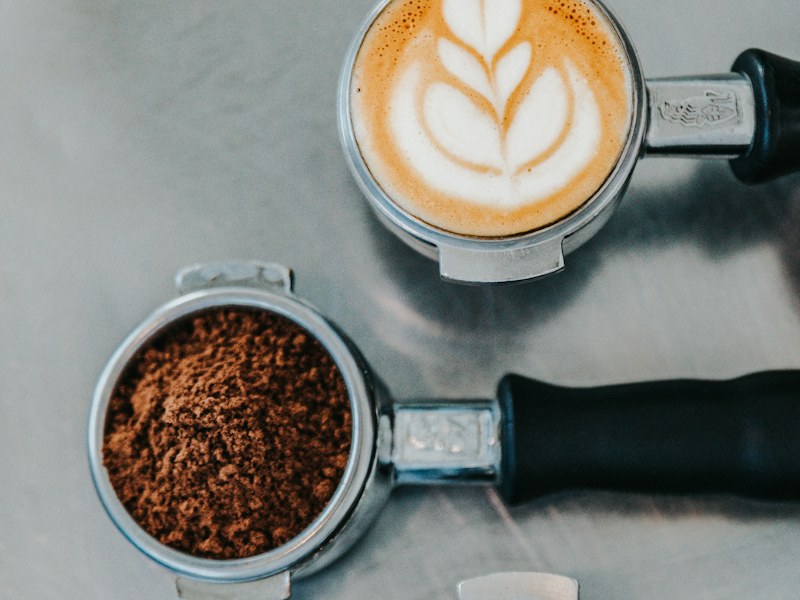 Coffee latte and coffee beans on a table