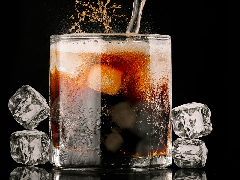 Glass of carbonated soft drink
