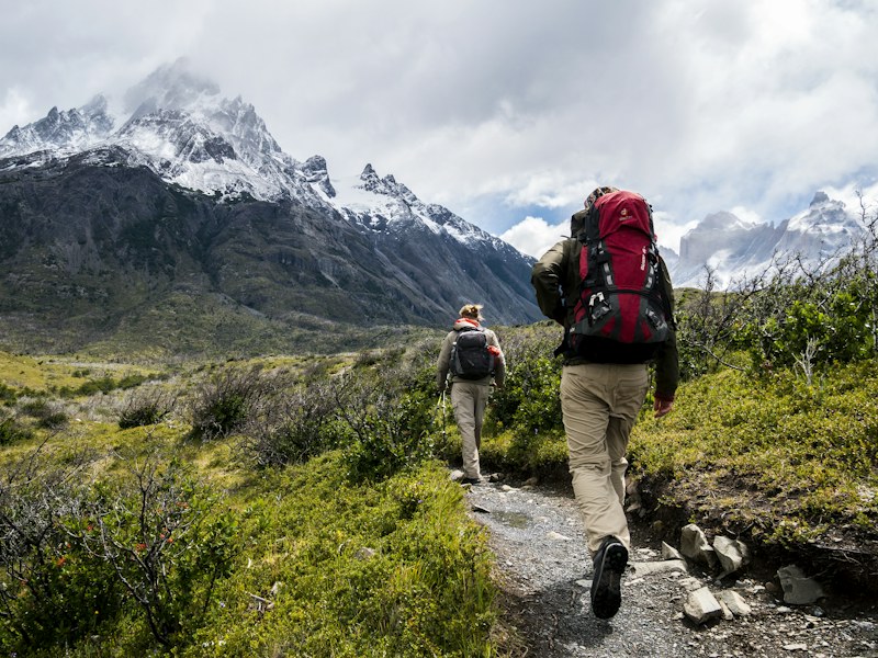 Hikers walking on a mountain trail