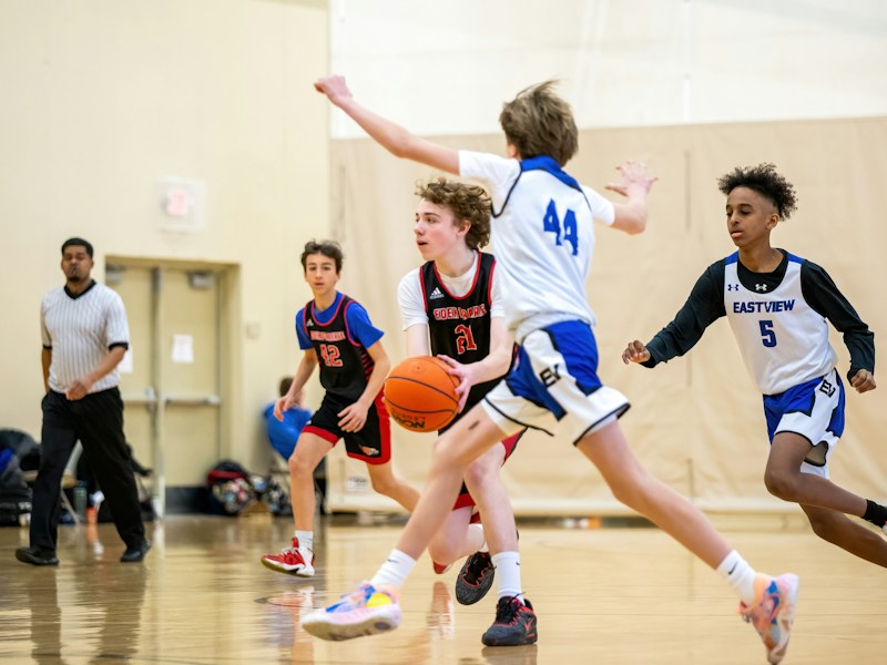Teenagers playing basketball for healthy growth